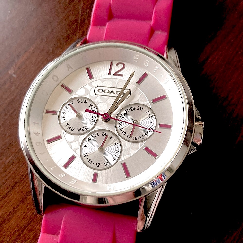 EUC Stainless Steel Coach watch. Magenta silicone band. Minimally worn.